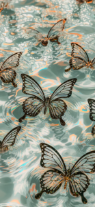 Stunning black butterflies with intricate details appear to float effortlessly on a surface of tranquil, rippling water. The soothing blue tones are highlighted by hints of golden and peach reflections, creating a magical and calming aesthetic. This HD butterfly wallpaper is ideal for iPhone and Samsung users who love elegant and nature-inspired designs. Bring a sense of beauty and peace to your smartphone with this captivating scene.