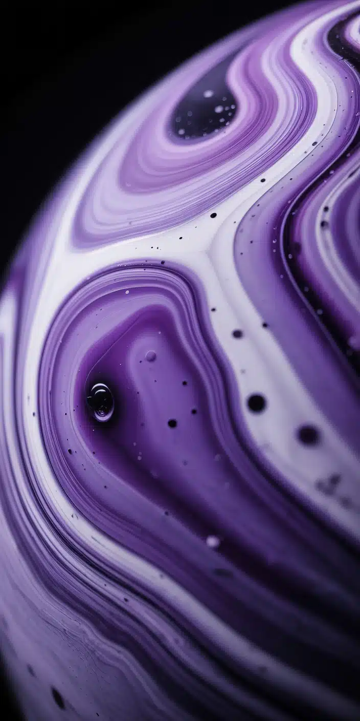 This stunning abstract planet is painted in flowing shades of purple, black, and white, resembling marble or fluid art. The intricate, organic swirls and speckled detail give it an artistic flair while keeping a cosmic theme. Ideal for fans of purple universe and artistic planet wallpaper iphone styles. A gorgeous and bold choice for smartphone screens.
