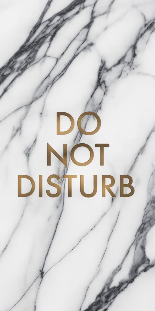 This minimalist wallpaper features elegant gold typography spelling “Do Not Disturb” over a sleek white marble background with soft gray veining. It’s an ideal pick for fans of Iphone Wallpaper Minimalist Quote and Do Not Disturb Aesthetic who love clean, luxurious design. The contrast between the metallic text and soft stone texture gives your phone a polished, upscale feel without being flashy.
