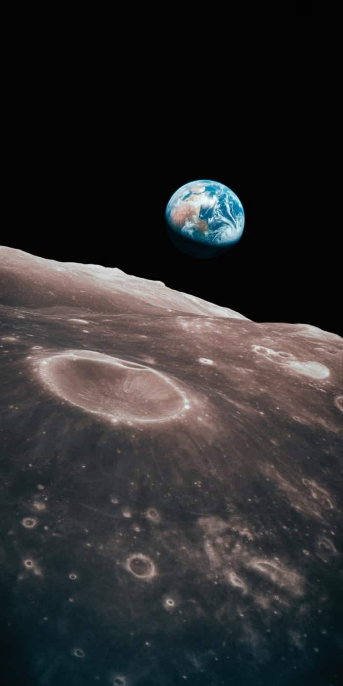 A realistic view of Earth rising above the lunar surface, captured in stunning clarity. The contrast between the rugged, cratered moon foreground and the vibrant blue Earth highlights the beauty and fragility of our planet. This earth wallpaper iphone is ideal for fans of planet photography and cosmic perspectives. A dramatic and awe-inspiring wallpaper for those who love space and planetary imagery.